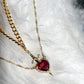 Collier avec pendentif cœur et épée en zircon superposé